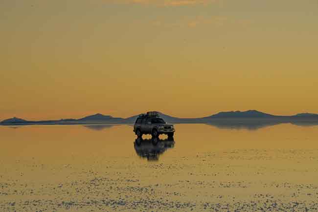 Photo by Murilo Fonseca: https://www.pexels.com/photo/suv-parked-on-the-shore-6320858/